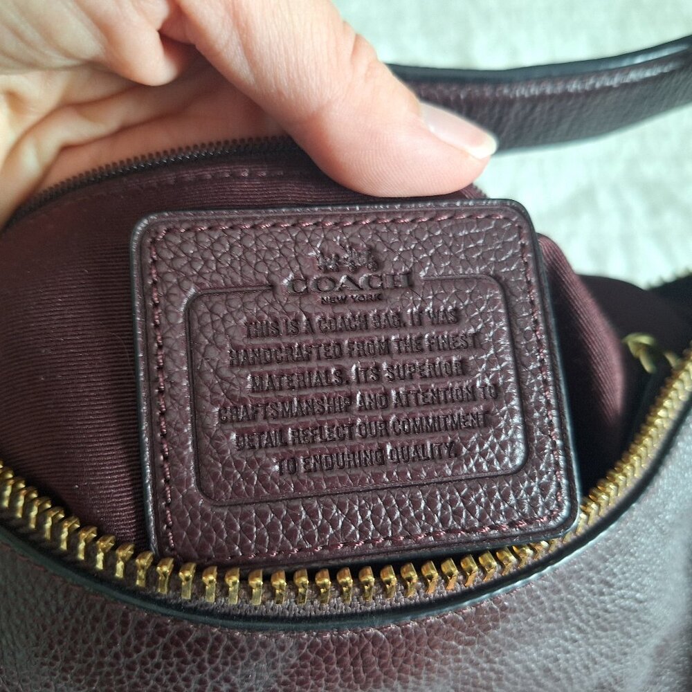 Plum coach purse